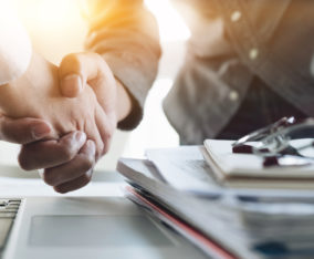 Close up of Business people shaking hands, finishing up meeting, business etiquette, congratulation, merger and acquisition concept